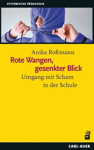 Rote Wangen, gesenkter Blick