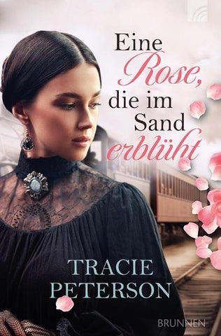 Eine Rose, die im Sand erblüht